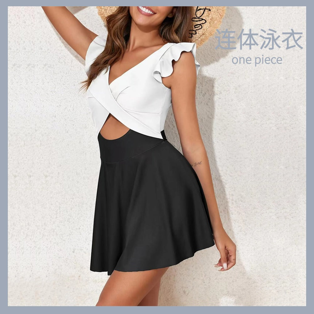 One-piece swimming suit with frilled cross-shaped skir